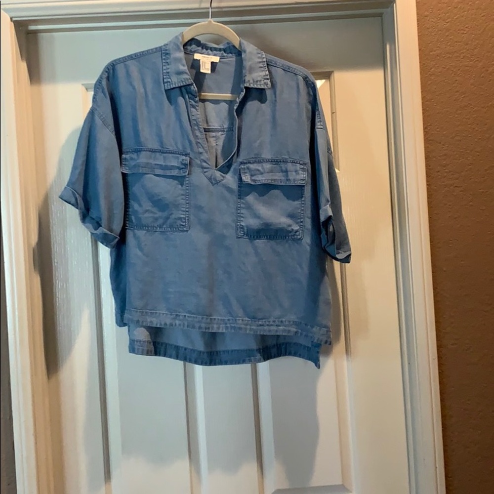Blue denim top.